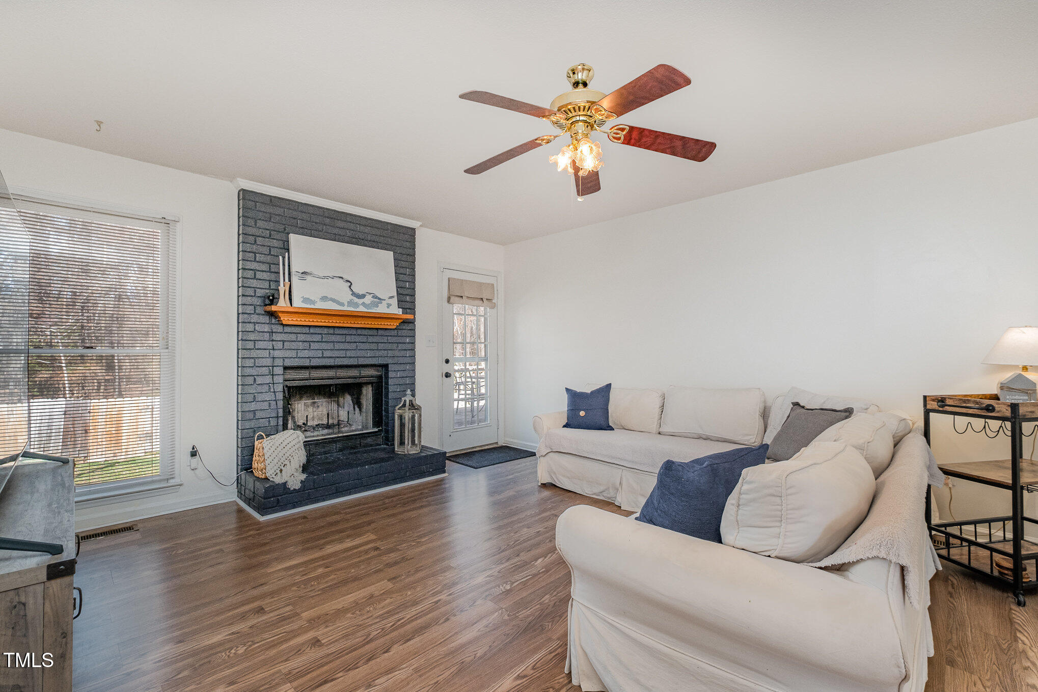 4213 Timberbrook Drive Raleigh, NC 27616 - Photo 5 of 37 a living room with furniture and a fireplace