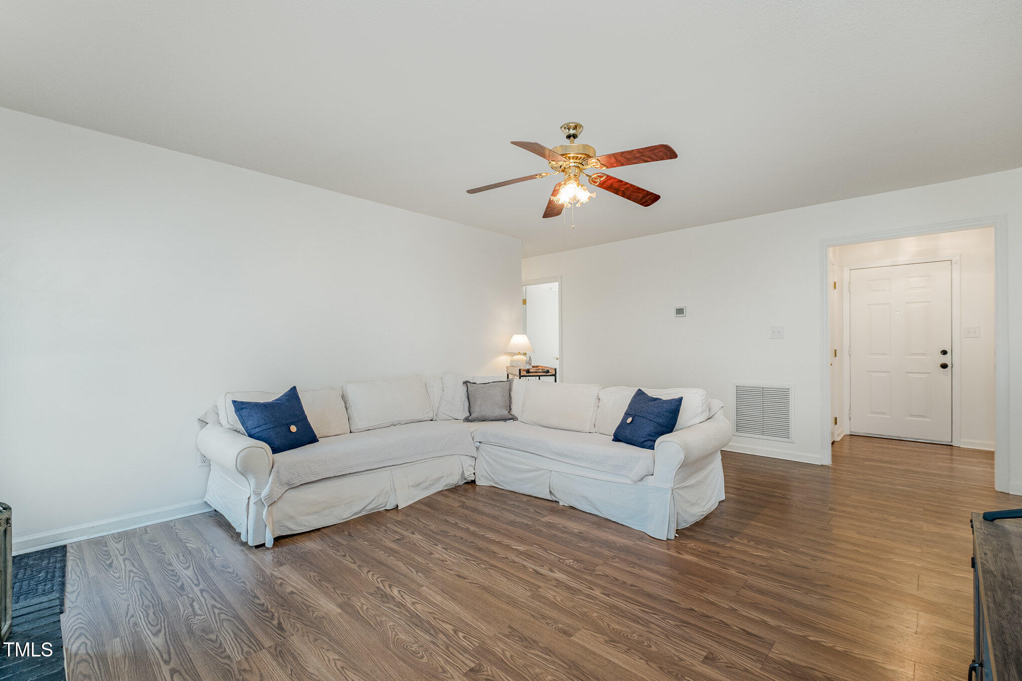 4213 Timberbrook Drive Raleigh, NC 27616 - Photo 7 of 37 a living room with furniture and a wooden floor