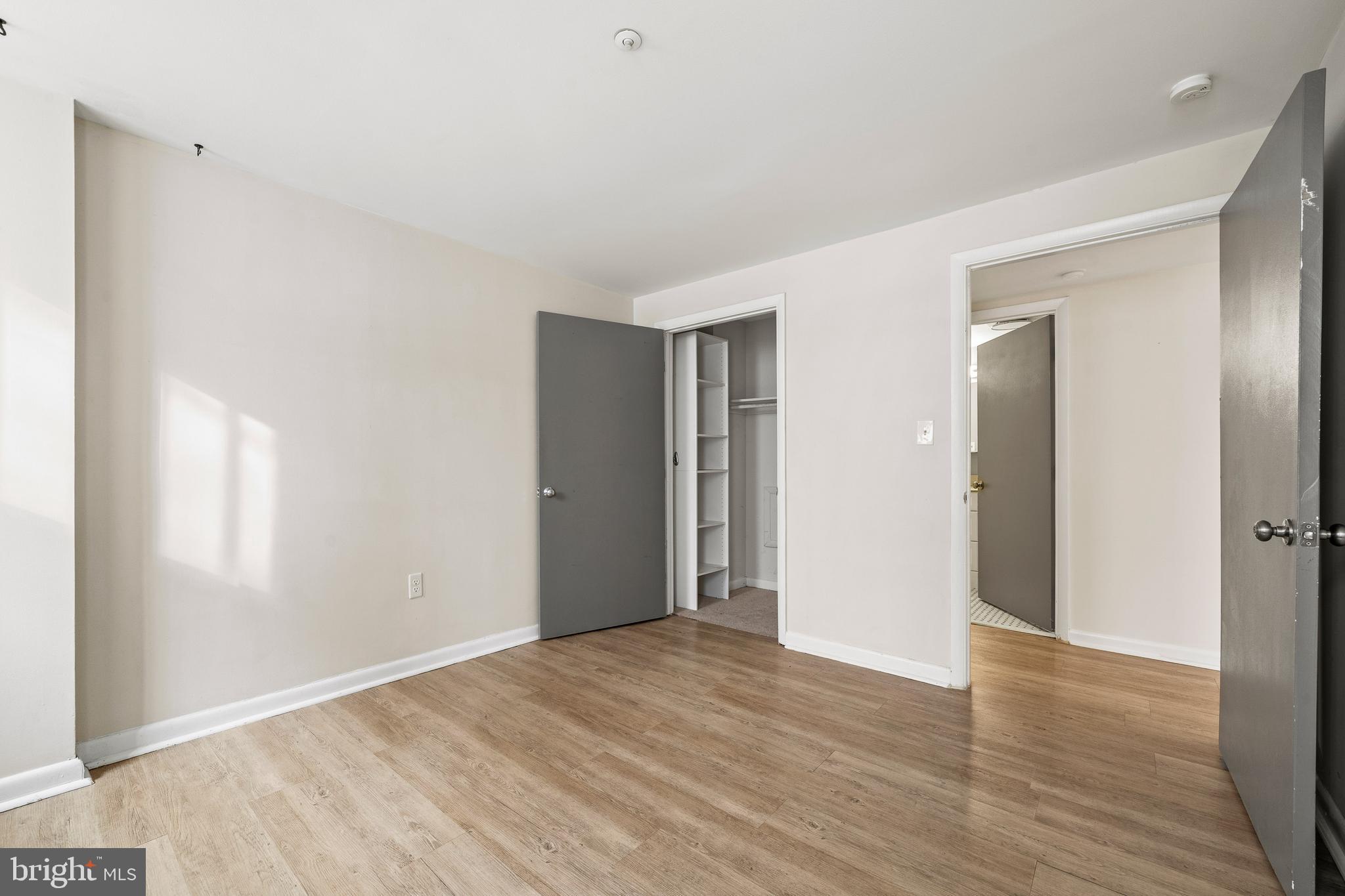 2633 Adams Mill Road Northwest, Unit B4 Washington, DC 20009 - Photo 19 of 24 a view of an empty room with wooden floor & closet