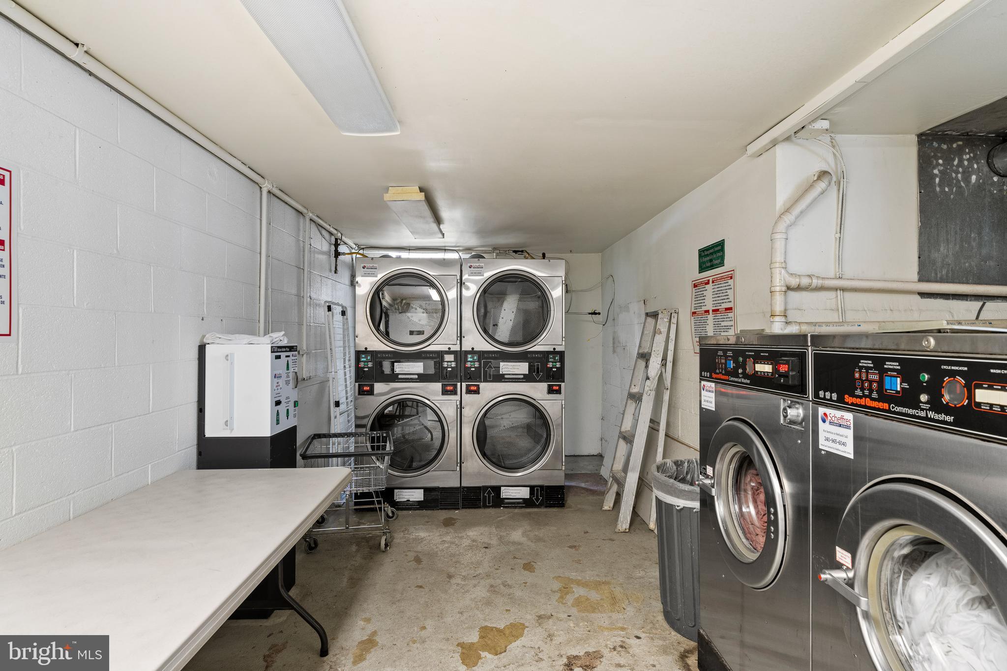 2633 Adams Mill Road Northwest, Unit B4 Washington, DC 20009 - Photo 22 of 24 a view of storage and utility room with washer and dryer