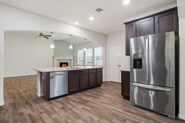 a kitchen with stainless steel appliances a refrigerator and a sink