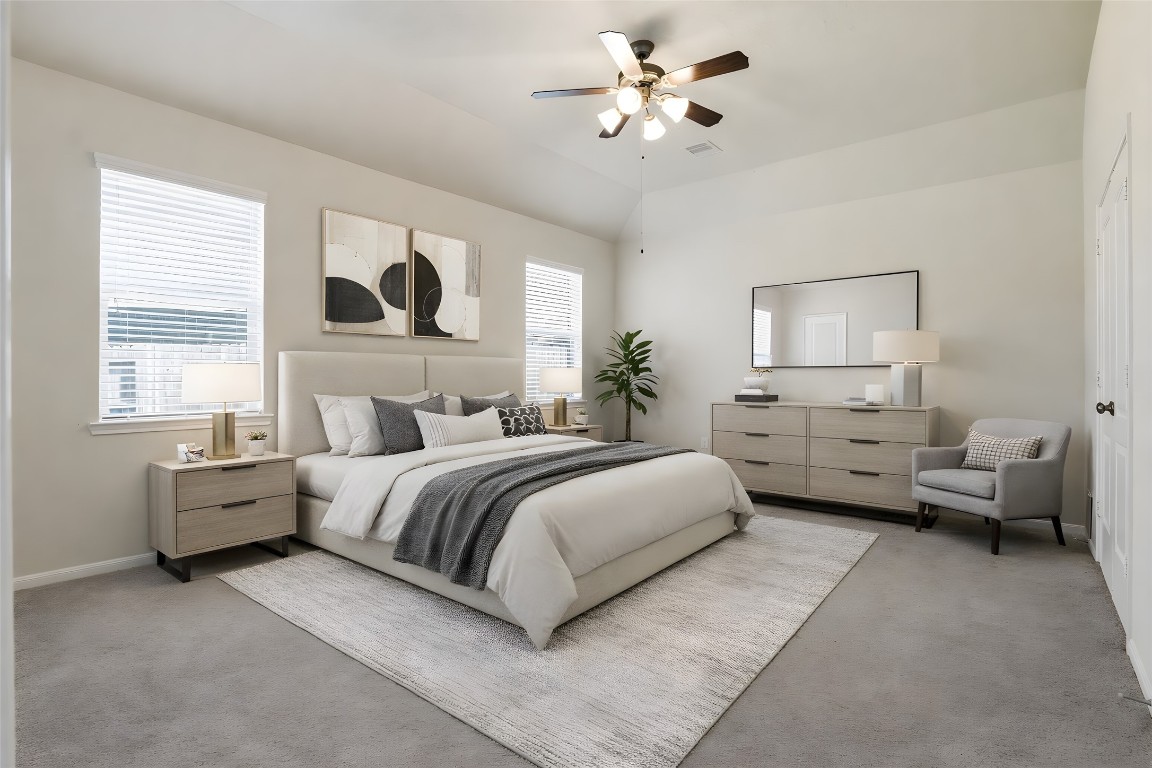 10007 Open Slope Court Humble, TX 77396 - Photo 19 of 39 a spacious bedroom with a bed a couch and window