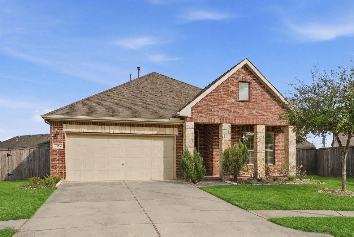 10007 Open Slope Court Humble, TX 77396 - Photo 2 of 39 a front view of a house with a yard