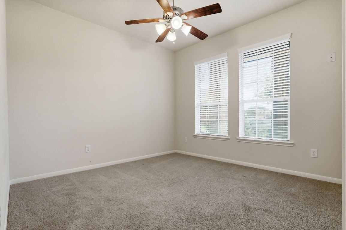 10007 Open Slope Court Humble, TX 77396 - Photo 28 of 39 a view of an empty room with a window
