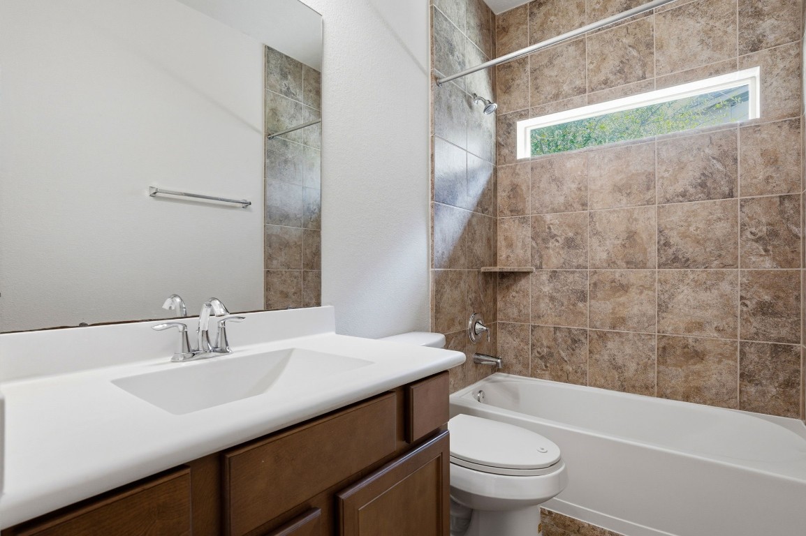 10007 Open Slope Court Humble, TX 77396 - Photo 31 of 39 a bathroom with a sink and a mirror