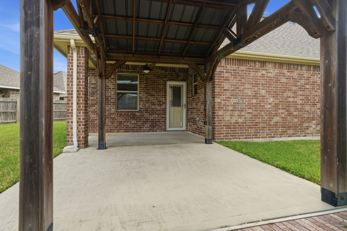 10007 Open Slope Court Humble, TX 77396 - Photo 33 of 39 a view of yellow house with a large door