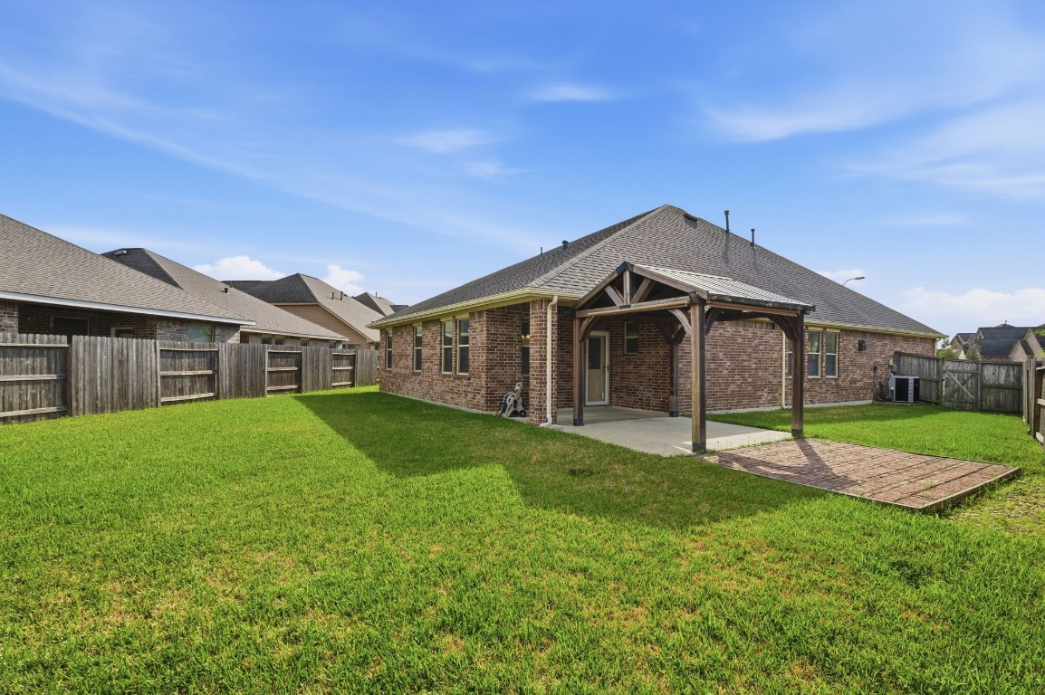10007 Open Slope Court Humble, TX 77396 - Photo 35 of 39 a house view with a garden space