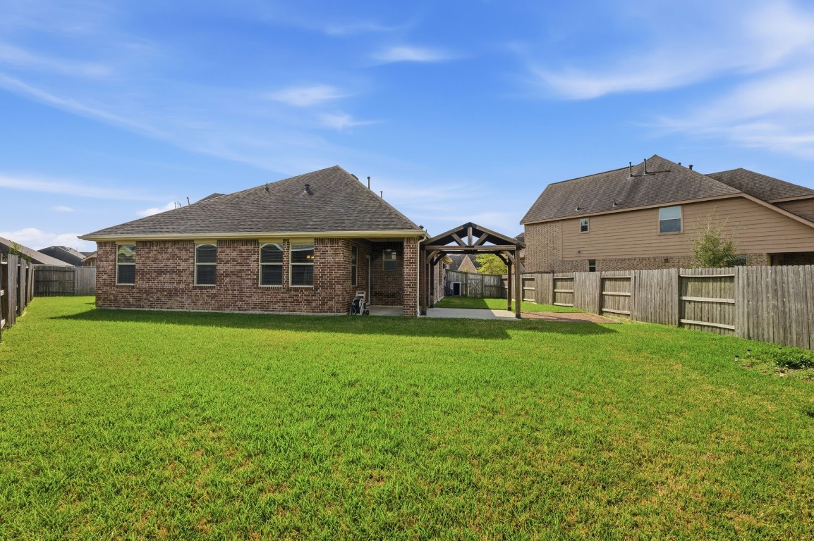 10007 Open Slope Court Humble, TX 77396 - Photo 36 of 39 a view of a house with a big yard