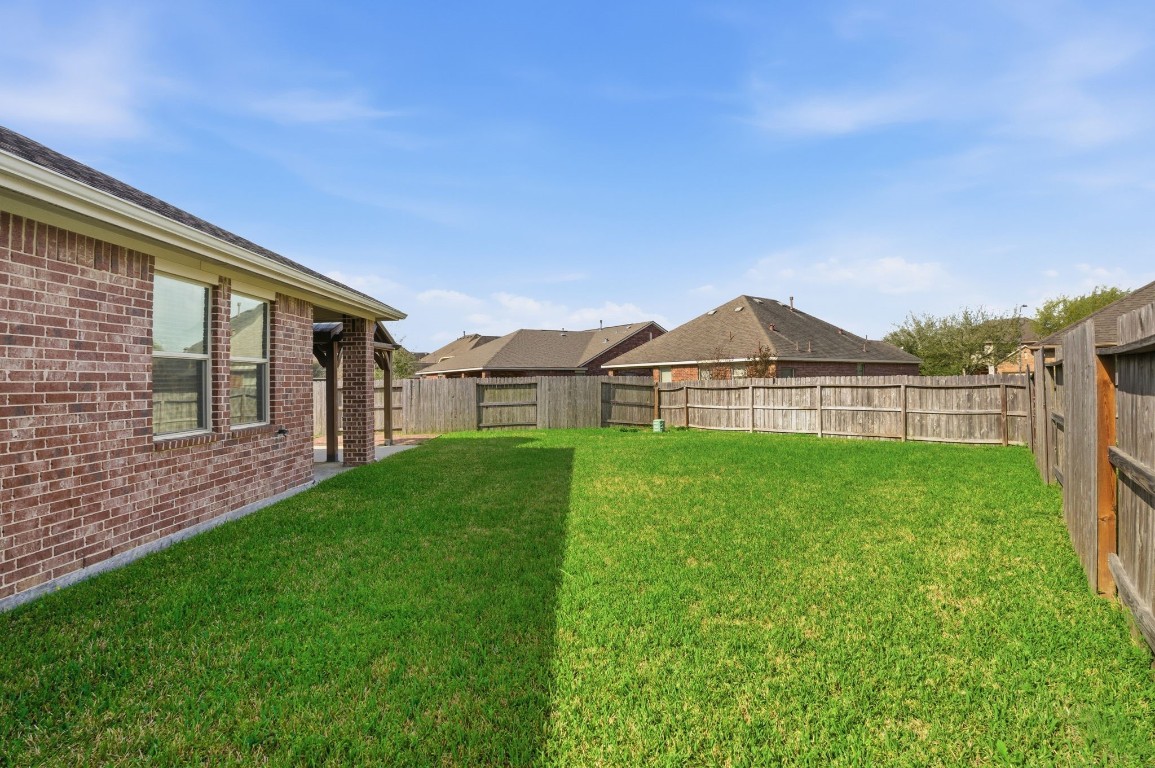 10007 Open Slope Court Humble, TX 77396 - Photo 37 of 39 a view of an house with backyard and garden