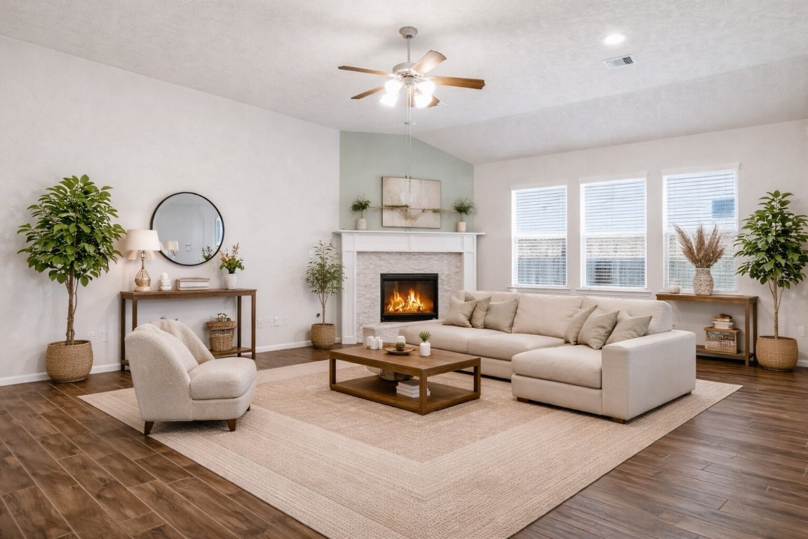 10007 Open Slope Court Humble, TX 77396 - Photo 5 of 39 a living room with furniture and a fireplace
