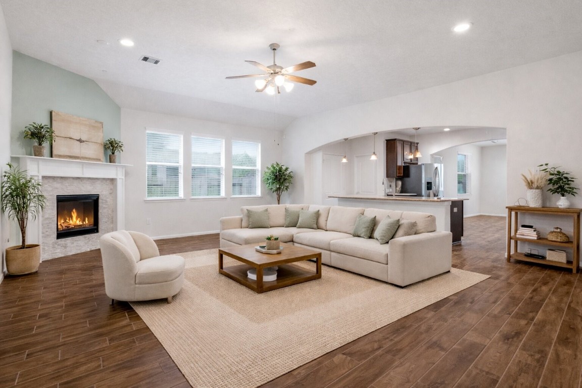 10007 Open Slope Court Humble, TX 77396 - Photo 7 of 39 a living room with furniture and a fireplace