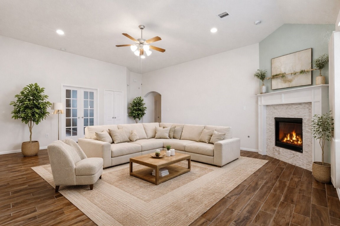 10007 Open Slope Court Humble, TX 77396 - Photo 10 of 39 a living room with furniture and a fireplace