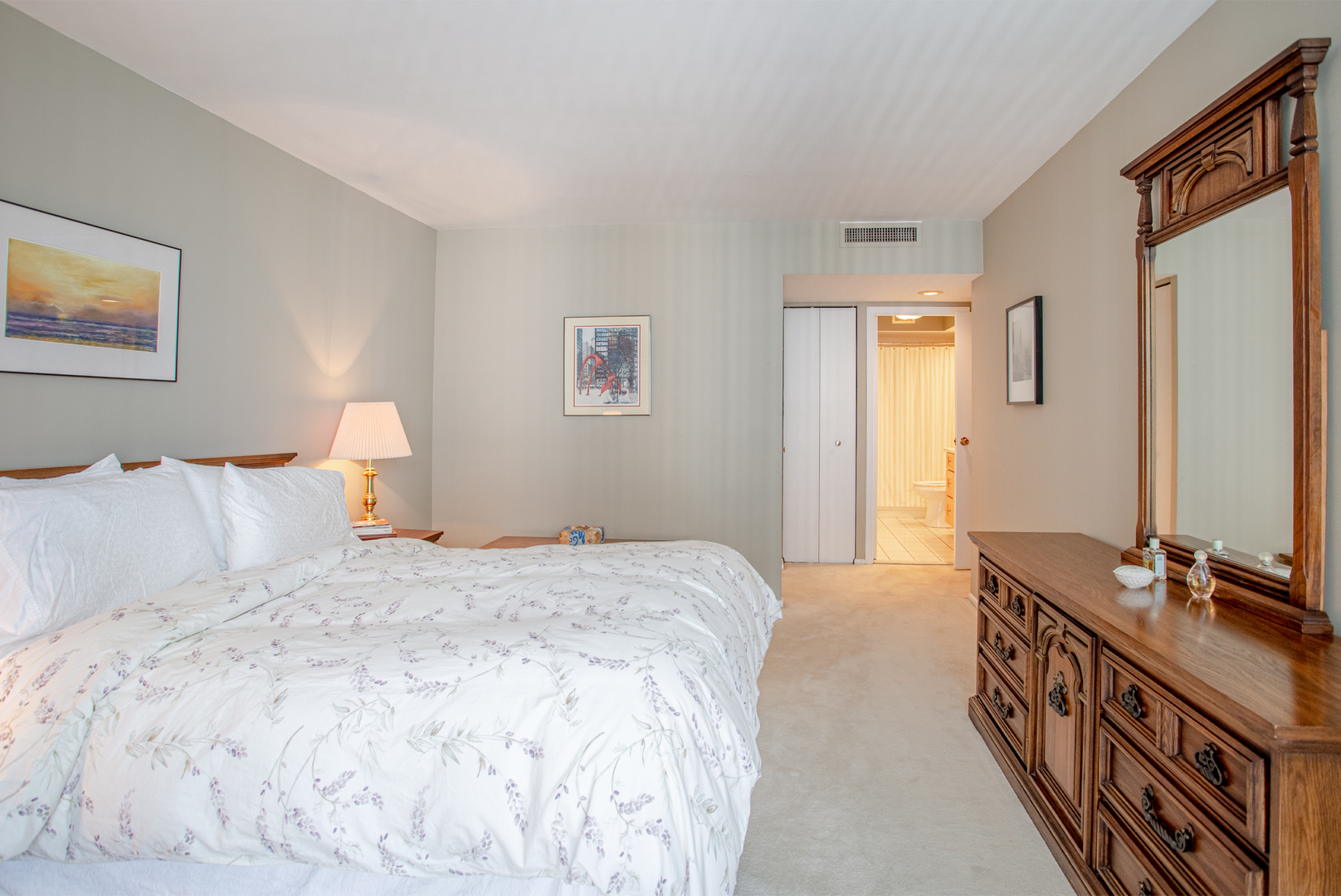 6007 North Sheridan Road, Unit 39D Chicago, IL 60660 - Photo 14 of 20 a bedroom with a bed and a flat screen tv