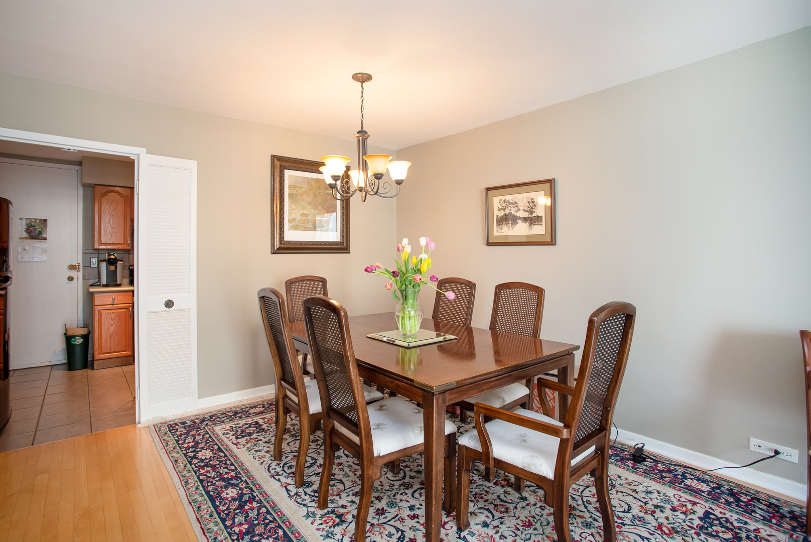 6007 North Sheridan Road, Unit 39D Chicago, IL 60660 - Photo 10 of 20 a view of a dining room with furniture and wooden floor