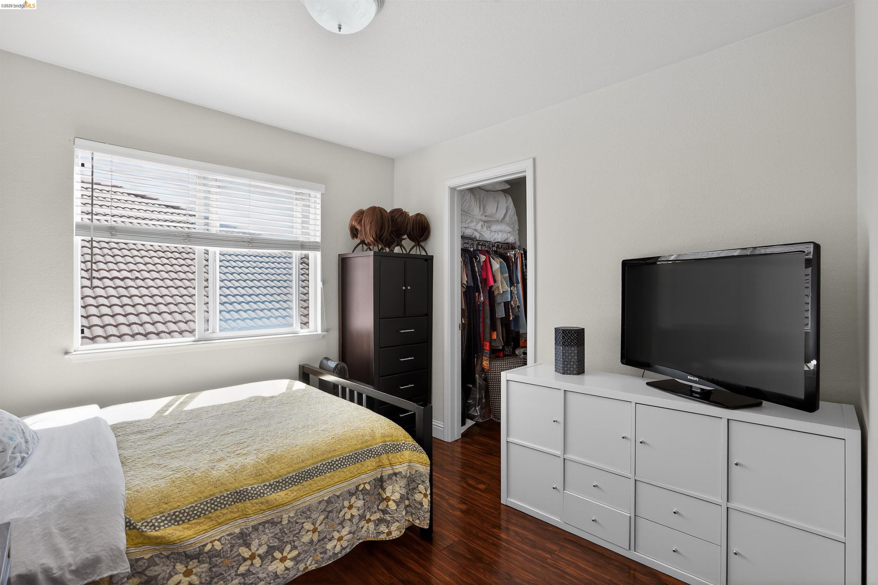 1221 Andrea Way Vallejo, CA 94591 - Photo 22 of 29 Spacious room featuring wood-finish flooring, a double window with blinds, and white walls