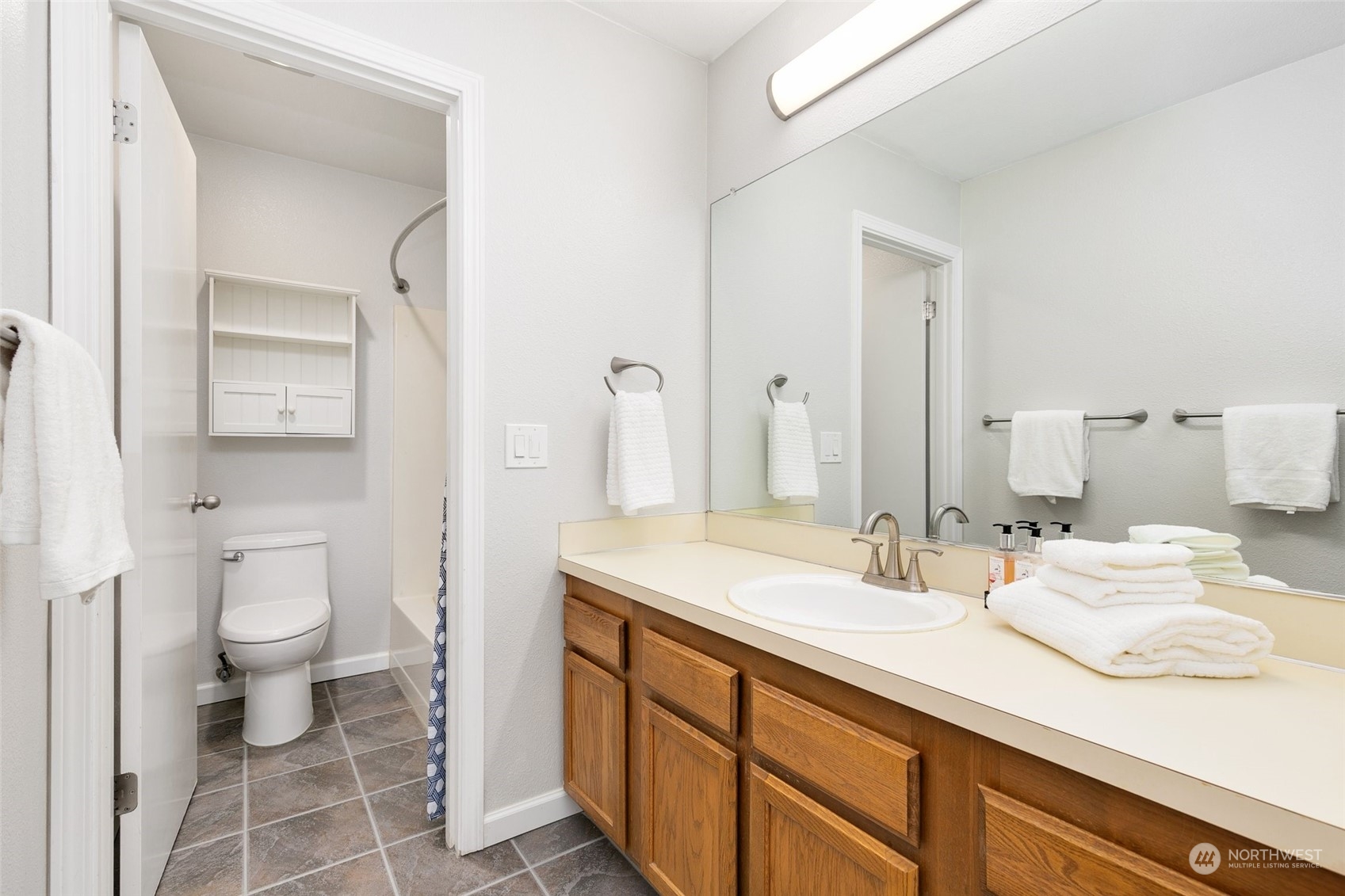 7355 Old Redmond Road, Unit 113 Redmond, WA 98052 - Photo 21 of 25 a bathroom with a sink and a mirror