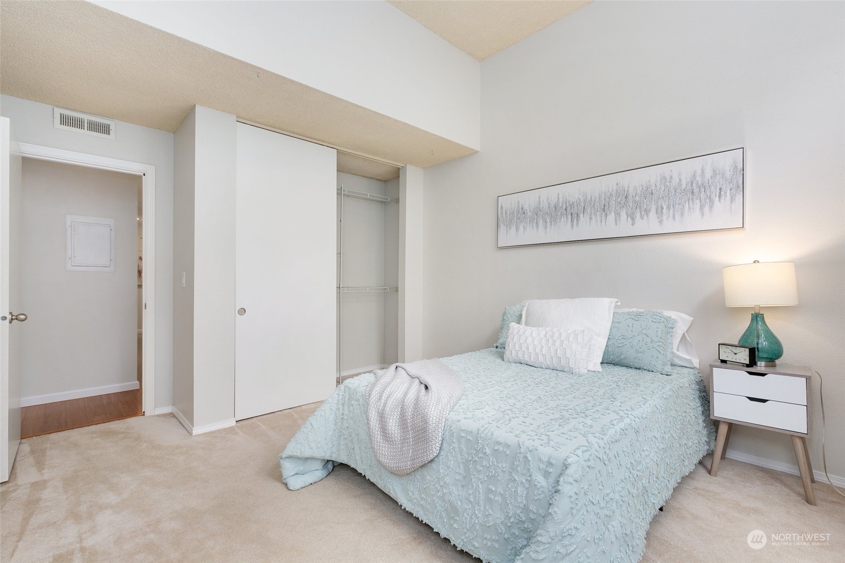 7355 Old Redmond Road, Unit 113 Redmond, WA 98052 - Photo 23 of 25 a bedroom with a bed and a lamp