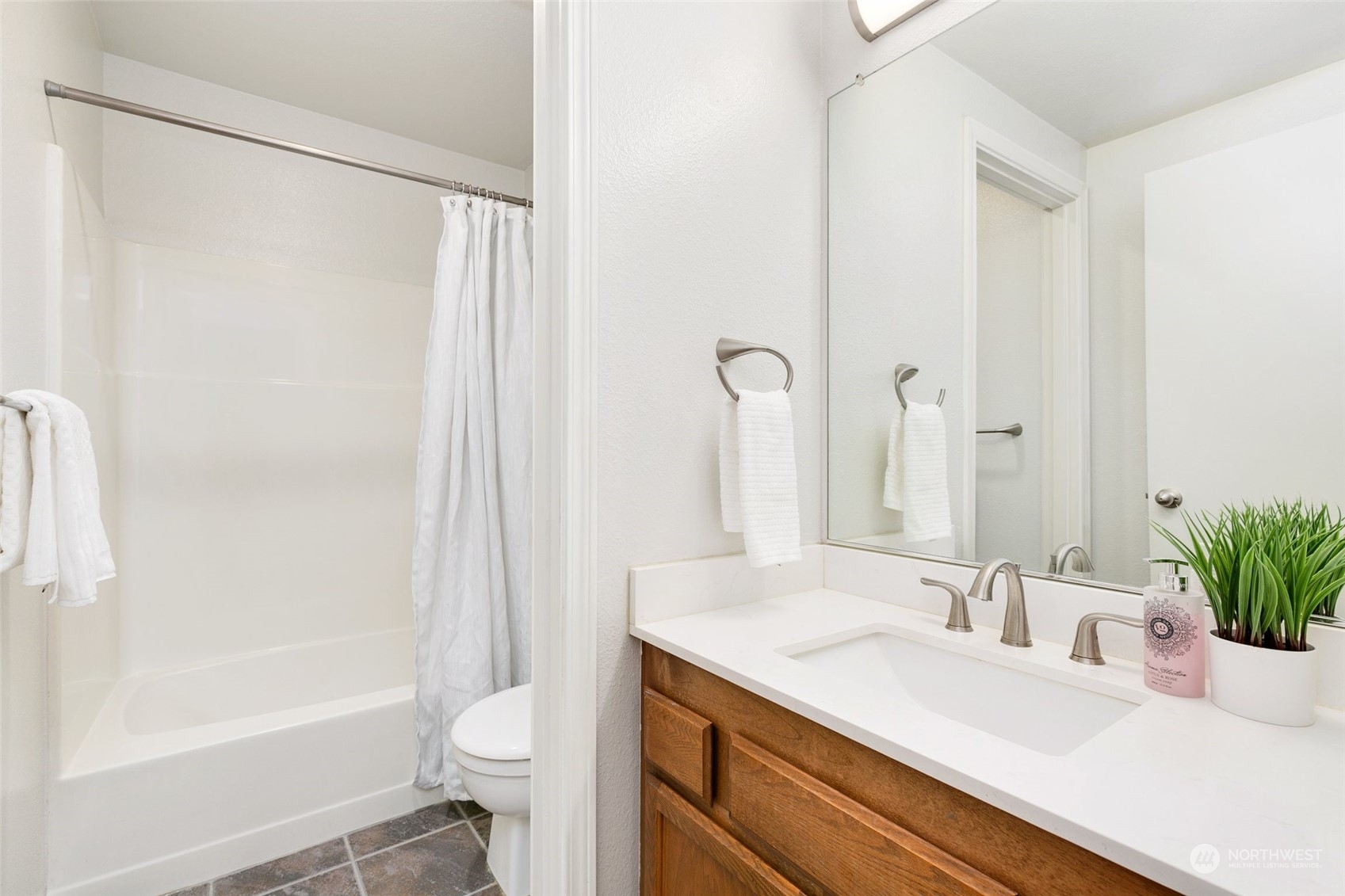 7355 Old Redmond Road, Unit 113 Redmond, WA 98052 - Photo 24 of 25 a bathroom with a granite countertop sink toilet and shower