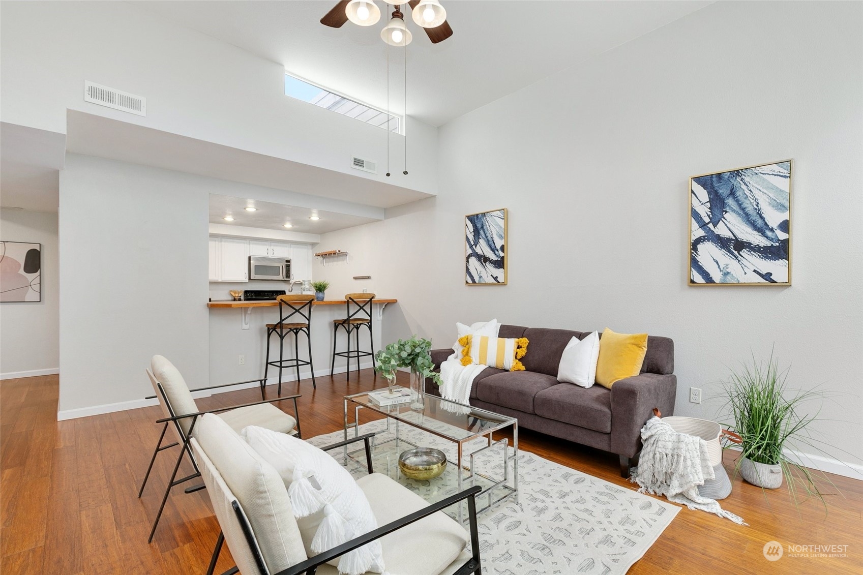 7355 Old Redmond Road, Unit 113 Redmond, WA 98052 - Photo 8 of 25 a living room with furniture and wooden floor