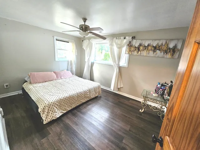 a bedroom with a bed and window