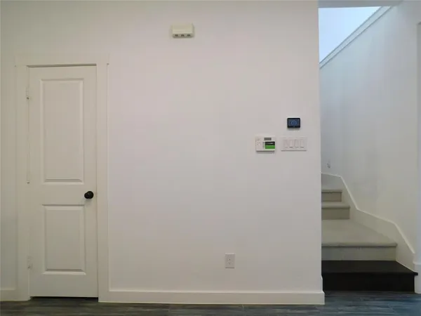 a view of entryway with wooden floor