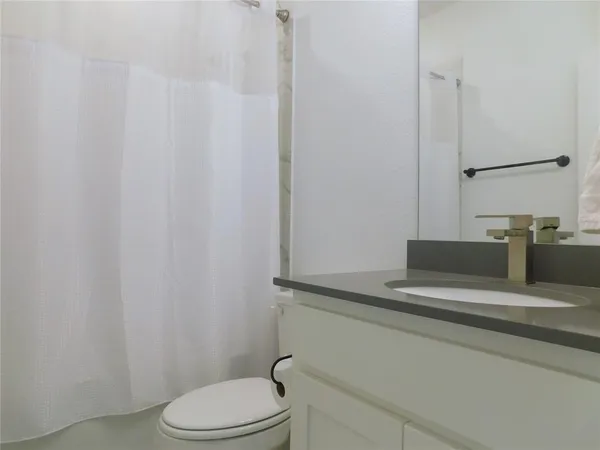 a bathroom with a toilet and a sink