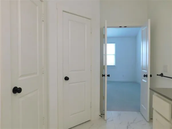 a bathroom with a shower sink and mirror