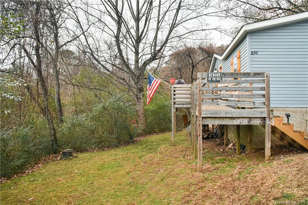 250 Mount Allen Road Black Mountain, NC 28711 - Photo 2 of 22 a view of a chairs and table in the backyard