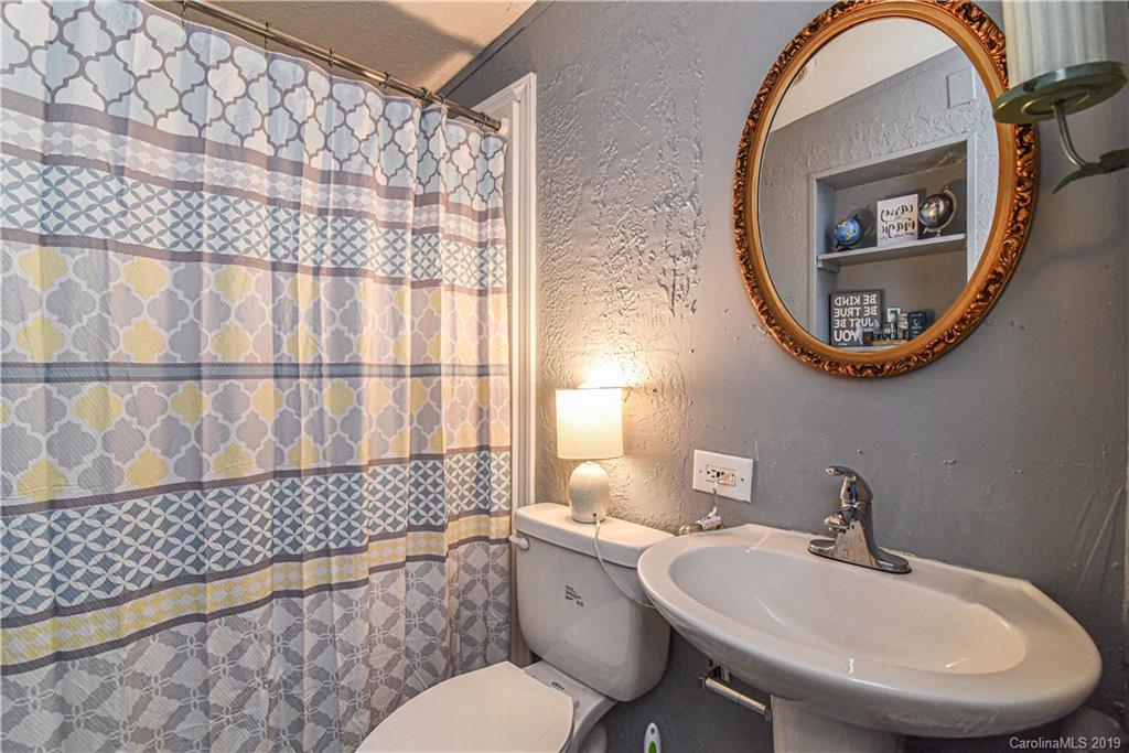 250 Mount Allen Road Black Mountain, NC 28711 - Photo 20 of 22 a bathroom with a sink and a mirror