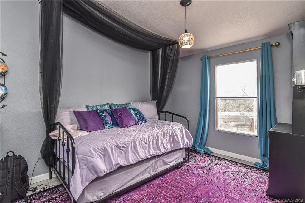 250 Mount Allen Road Black Mountain, NC 28711 - Photo 21 of 22 a bedroom with a bed and a window