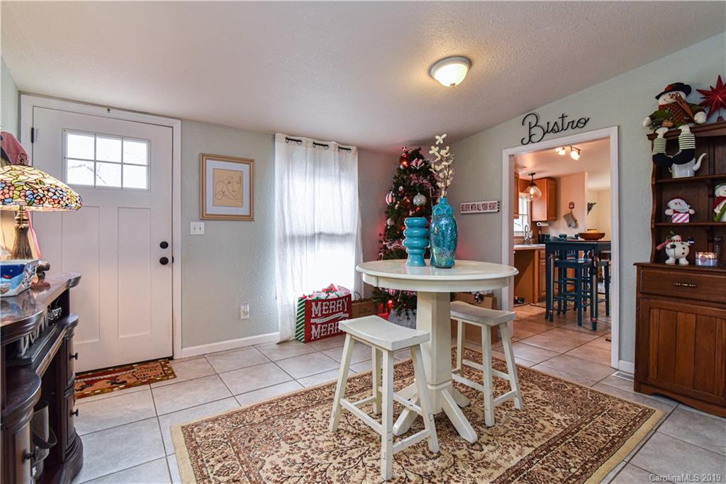 250 Mount Allen Road Black Mountain, NC 28711 - Photo 8 of 22 a dining room with furniture and window