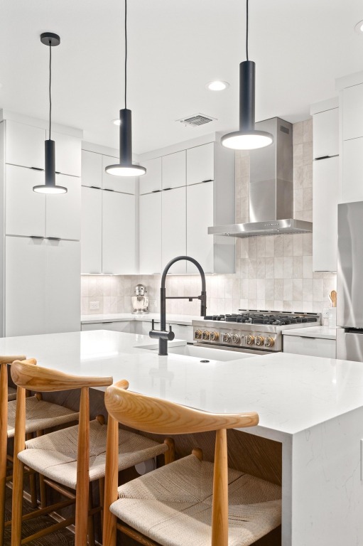 2104 East 2nd Street, Unit 1 Austin, TX 78702 - Photo 11 of 39 a kitchen with a table chairs and appliances