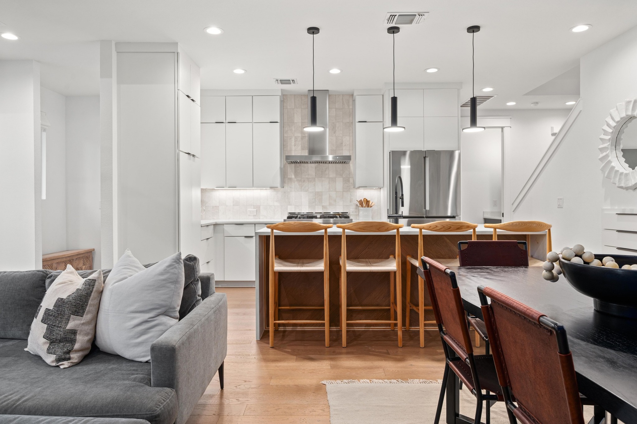 2104 East 2nd Street, Unit 1 Austin, TX 78702 - Photo 39 of 39 a dinning room with stainless steel appliances kitchen island granite countertop a dining table chairs and a refrigerator