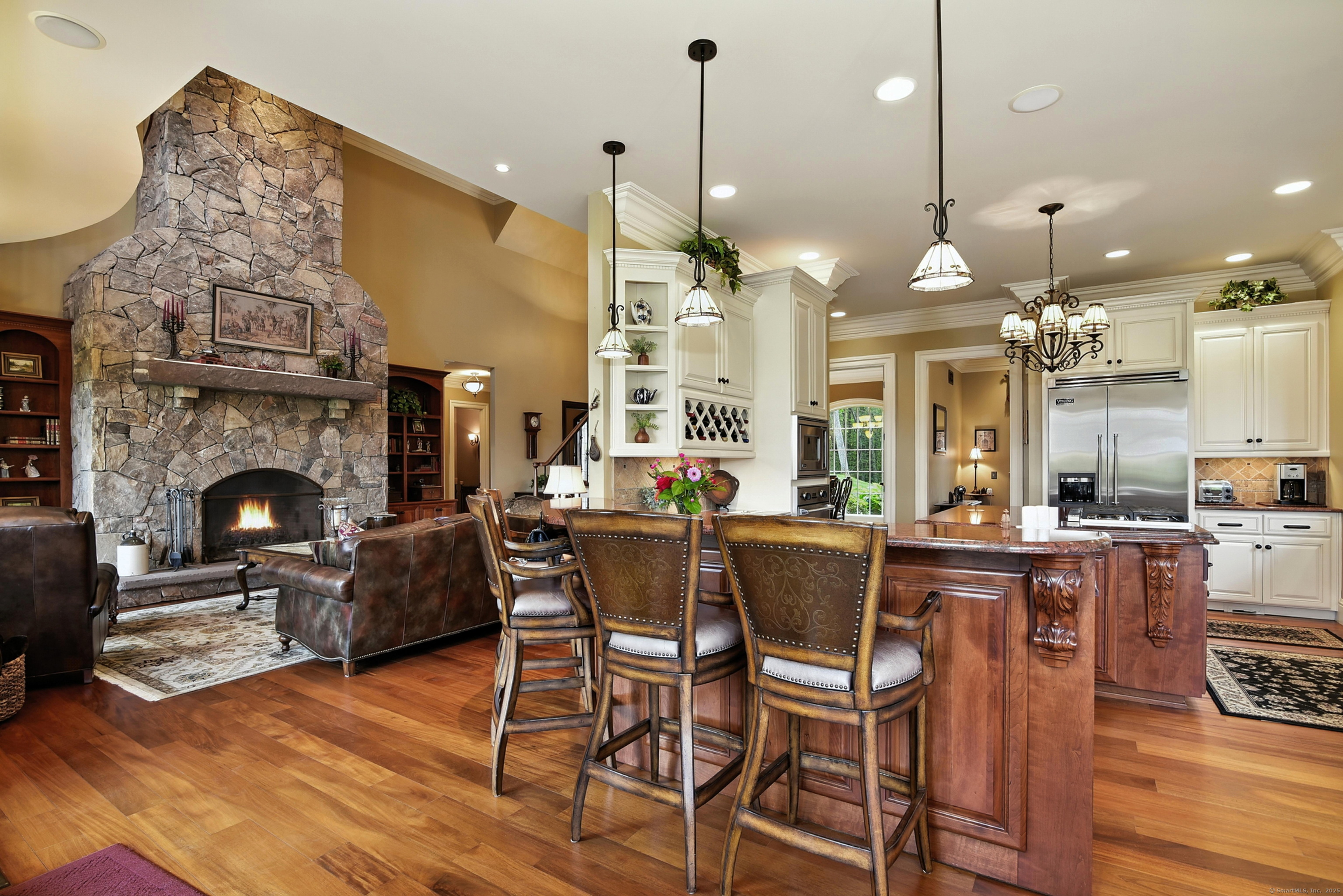 282 Searles Road Pomfret, CT 06259 - Photo 9 of 40 Open to the living and morning rooms, the cherry L-shaped bar highlights fine craftsmanship with solid cherry 13" corbels, cherry raised-panel backing, and a granite countertop.