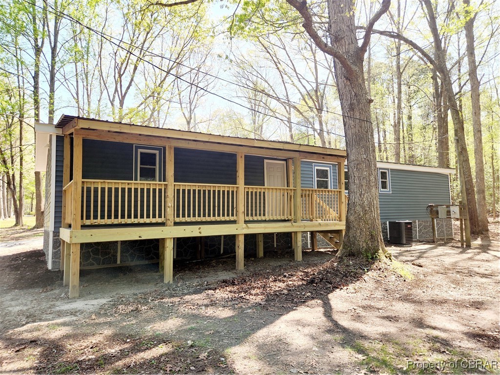 10766 Figg Shop Road Gloucester, VA 23061 - Photo 21 of 24 Rear view of house with covered Deck