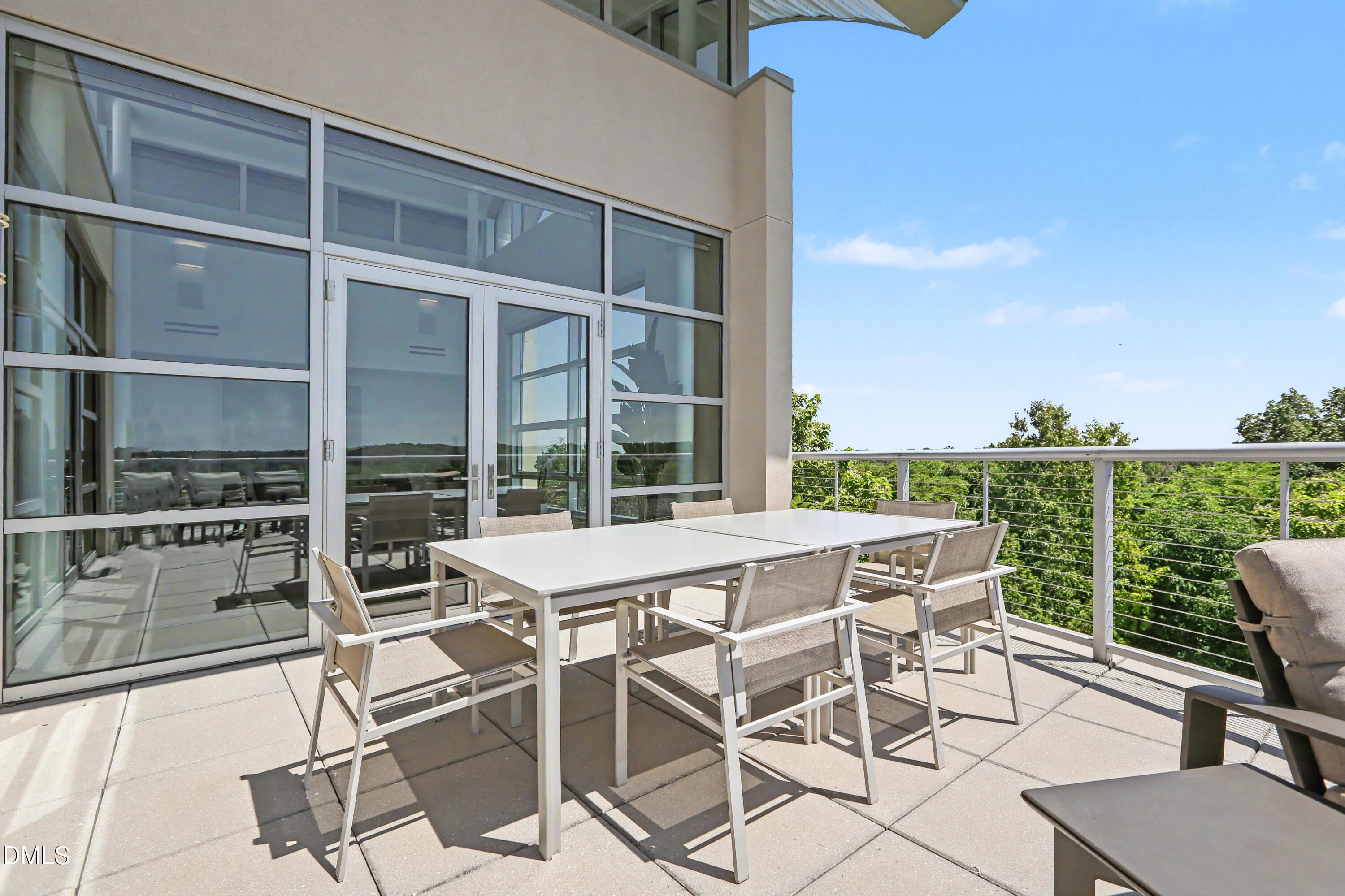 331 West Barbee Chapel Road Chapel Hill, NC 27517 - Photo 58 of 92 a view of a patio with a table and chairs and potted plants
