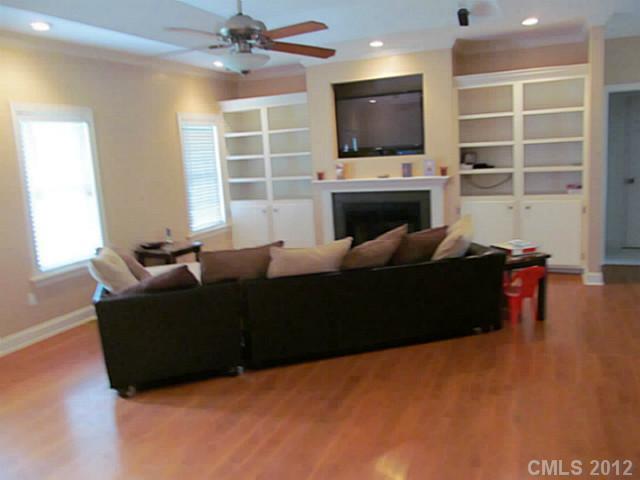 8093 Summit Ridge Drive Catawba, NC 28609 - Photo 3 of 16 a living room with furniture a fireplace and a flat screen tv