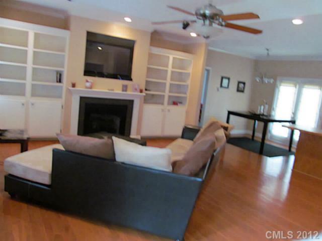 8093 Summit Ridge Drive Catawba, NC 28609 - Photo 4 of 16 a living room with furniture a fireplace and a flat screen tv