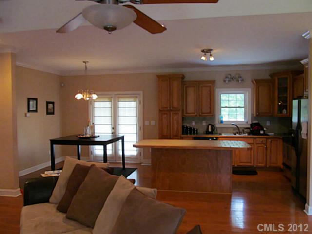 8093 Summit Ridge Drive Catawba, NC 28609 - Photo 5 of 16 a kitchen with a table chairs microwave and cabinets
