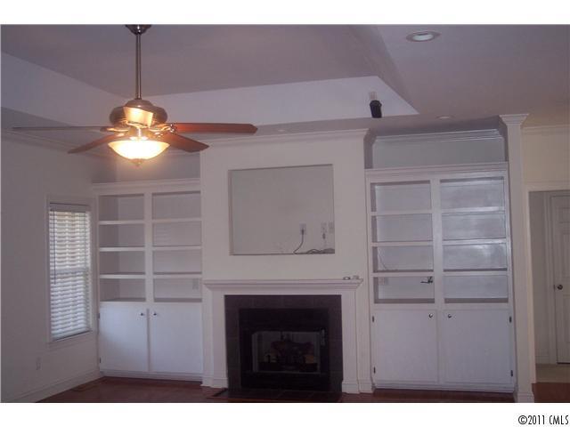 8093 Summit Ridge Drive Catawba, NC 28609 - Photo 6 of 16 a kitchen with a fireplace and a chandelier