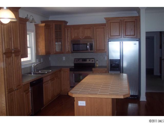 8093 Summit Ridge Drive Catawba, NC 28609 - Photo 9 of 16 a kitchen with stainless steel appliances granite countertop a stove a refrigerator and a microwave