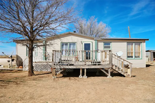 a front view of a house with a patio