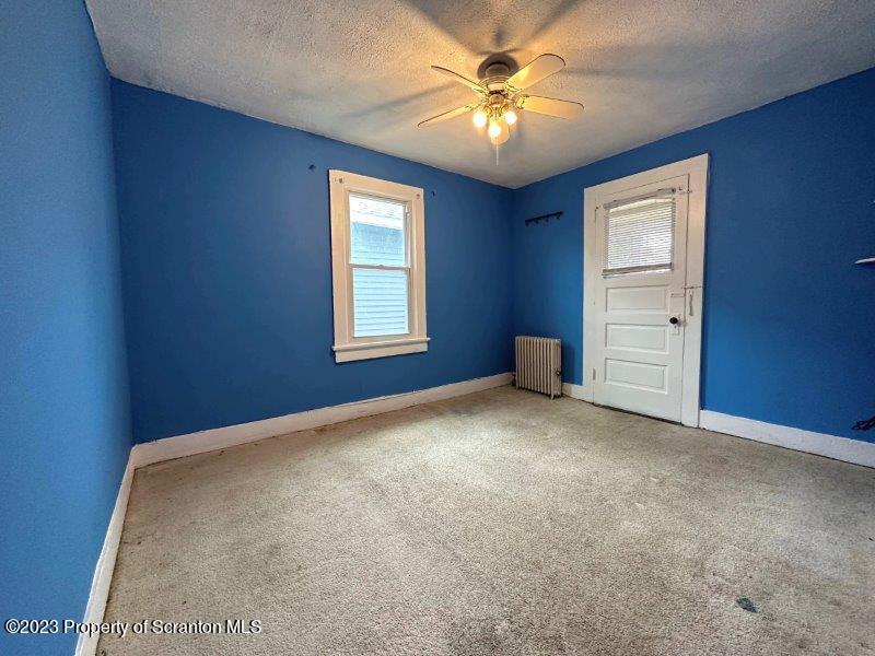 428 Cherry Street Scranton, PA 18505 - Photo 14 of 29 an empty room with windows and closet