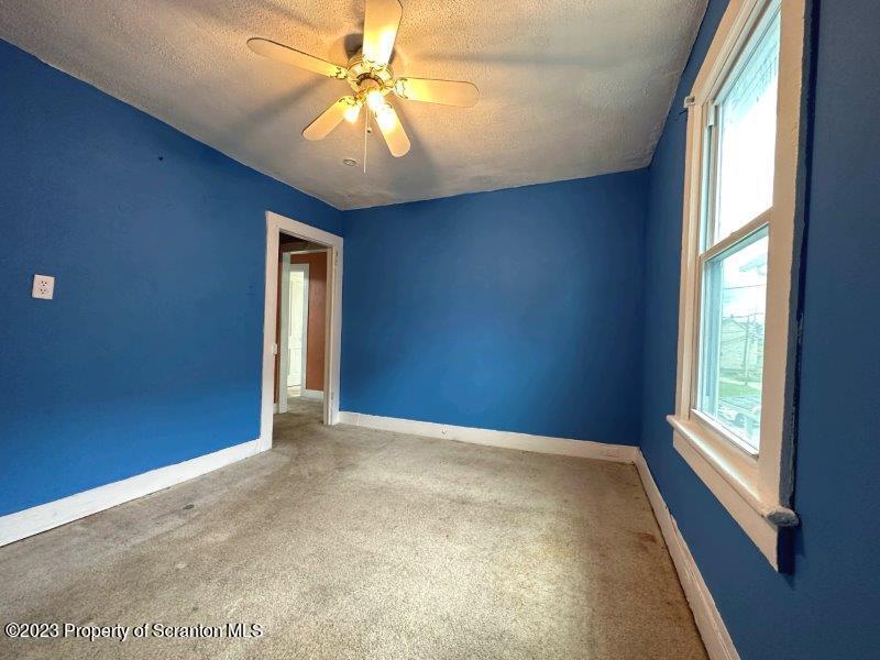428 Cherry Street Scranton, PA 18505 - Photo 15 of 29 an empty room with windows and fan