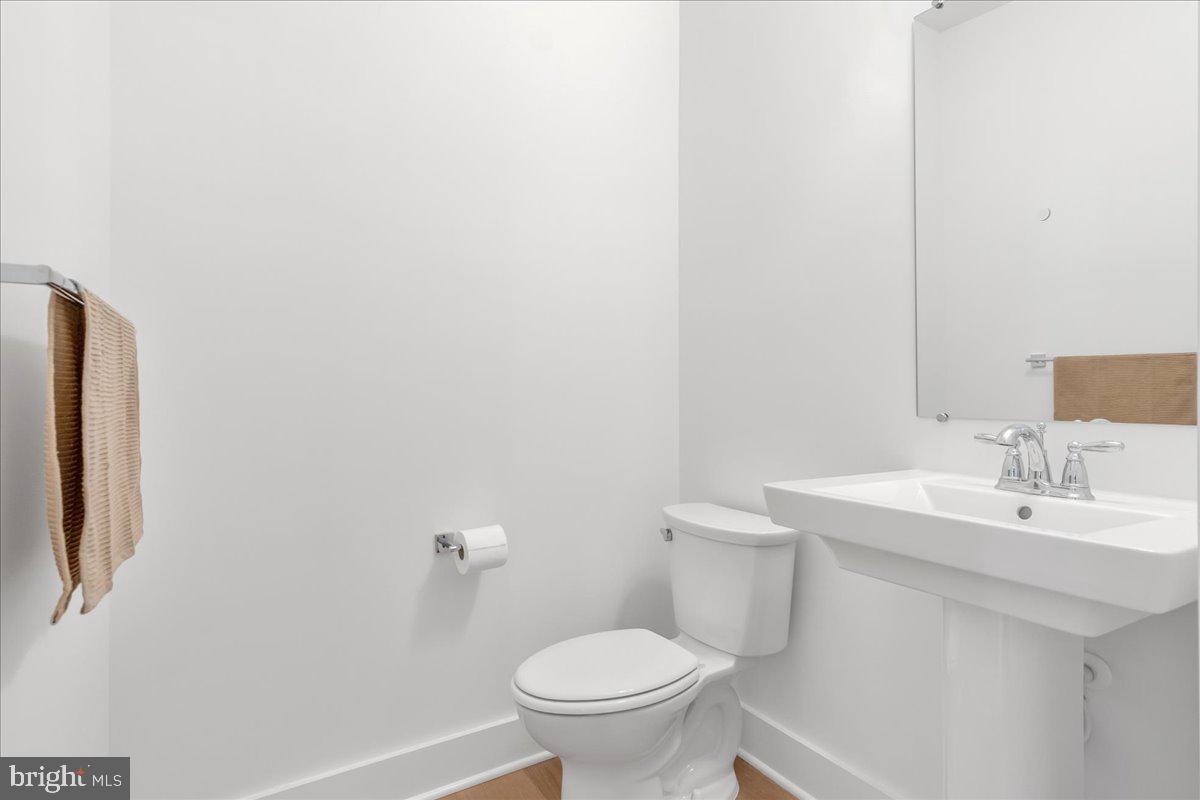 8 Grim Road Stephens City, VA 22655 - Photo 15 of 29 a bathroom with a sink a toilet and a mirror