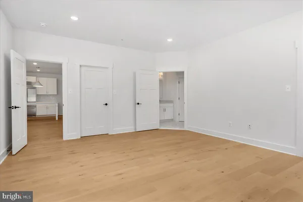 a bathroom with a sink vanity and a mirror