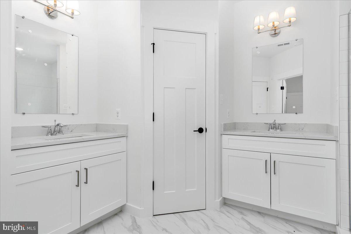 8 Grim Road Stephens City, VA 22655 - Photo 18 of 29 a bathroom with a sink vanity and a mirror