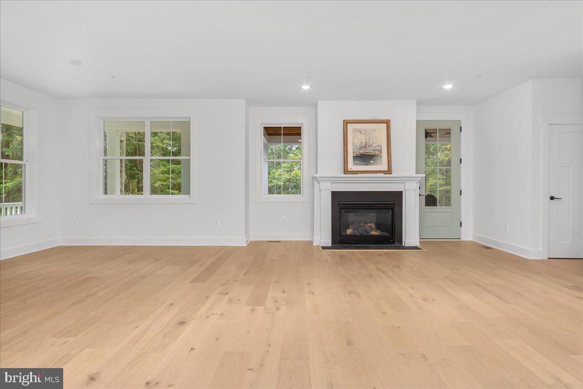 8 Grim Road Stephens City, VA 22655 - Photo 2 of 29 a view of an empty room with a window and fireplace