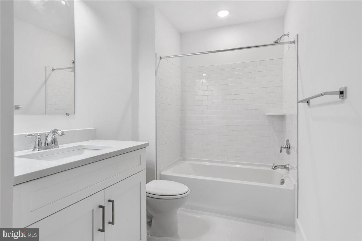 8 Grim Road Stephens City, VA 22655 - Photo 25 of 29 a bathroom with a granite countertop sink toilet and shower