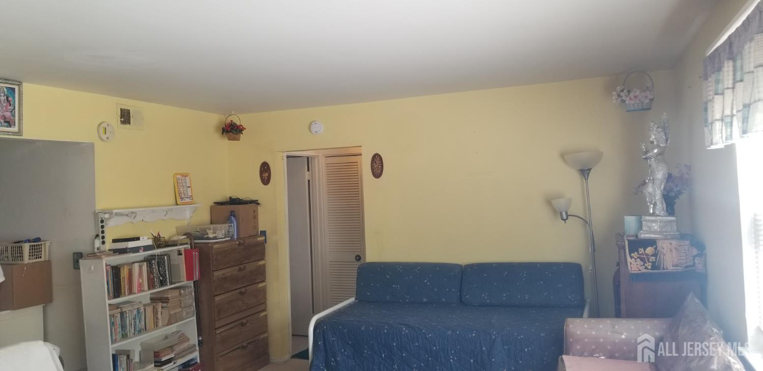 32 Judson Street, Unit 10A Edison, NJ 08837 - Photo 8 of 12 a living room with furniture and a table